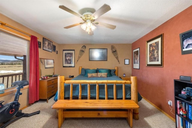 bedroom featuring ceiling fan and light colored carpet