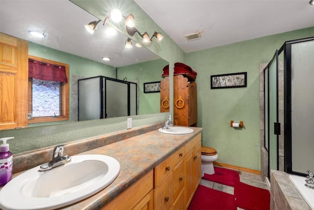 full bathroom featuring tile patterned flooring, vanity, toilet, and independent shower and bath