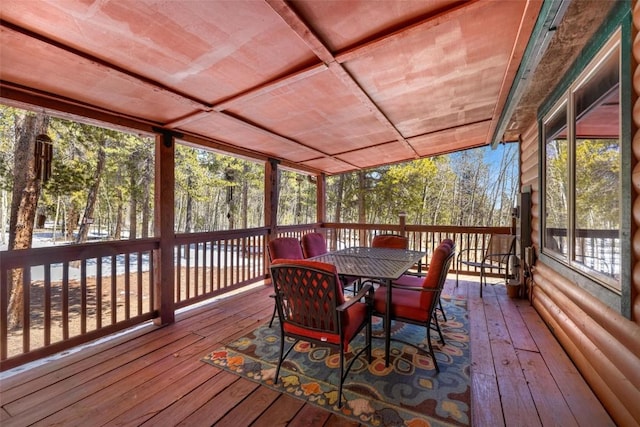 sunroom / solarium featuring wood ceiling