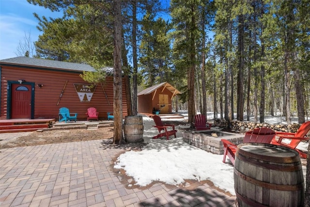 view of patio with an outbuilding