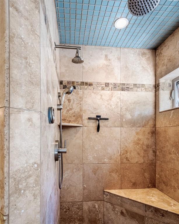 bathroom with tiled shower