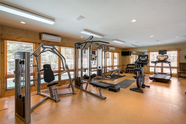 exercise room with an AC wall unit