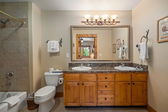 full bathroom featuring tile patterned flooring, ceiling fan, tiled shower / bath combo, toilet, and vanity