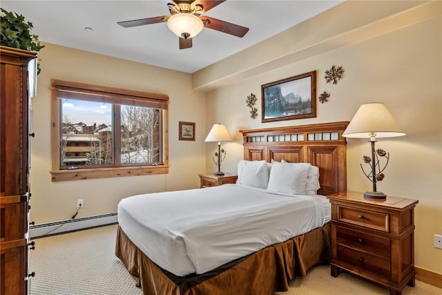 bedroom with ceiling fan, a baseboard radiator, and light carpet