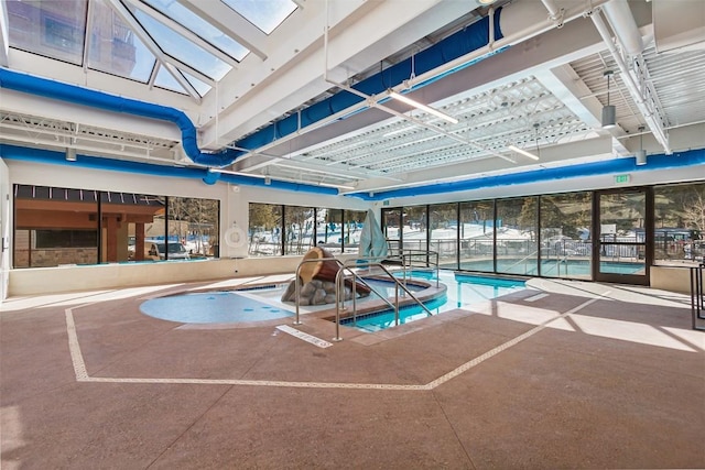 view of pool featuring a skylight