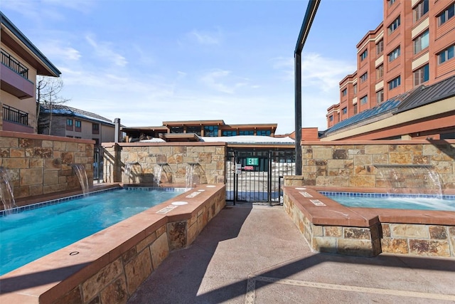 view of pool featuring pool water feature