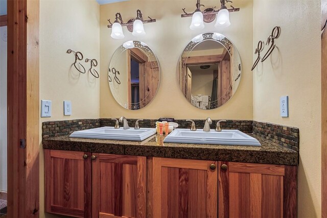 bathroom featuring decorative backsplash and vanity