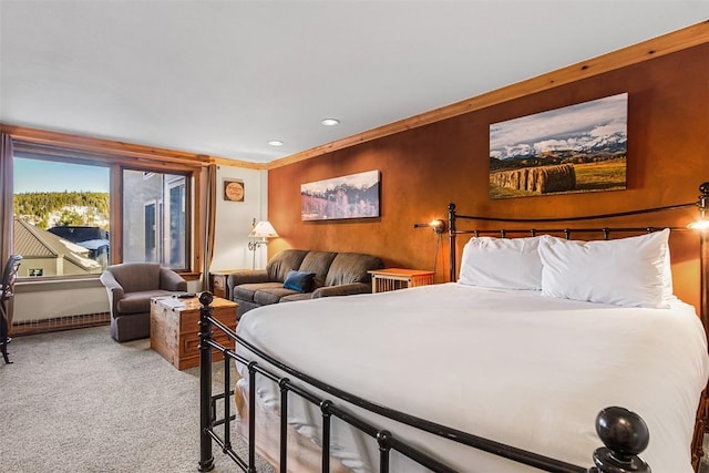 carpeted bedroom featuring crown molding