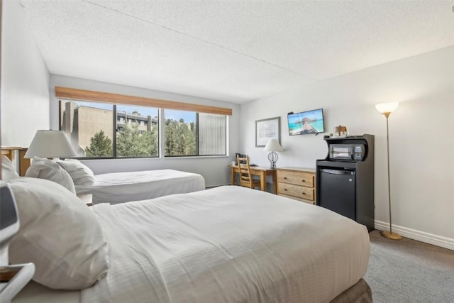 bedroom with carpet and a textured ceiling