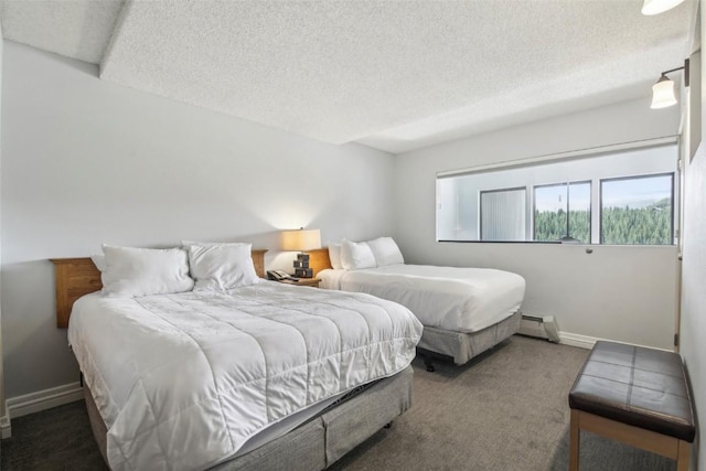 bedroom featuring a textured ceiling, dark carpet, and a baseboard radiator