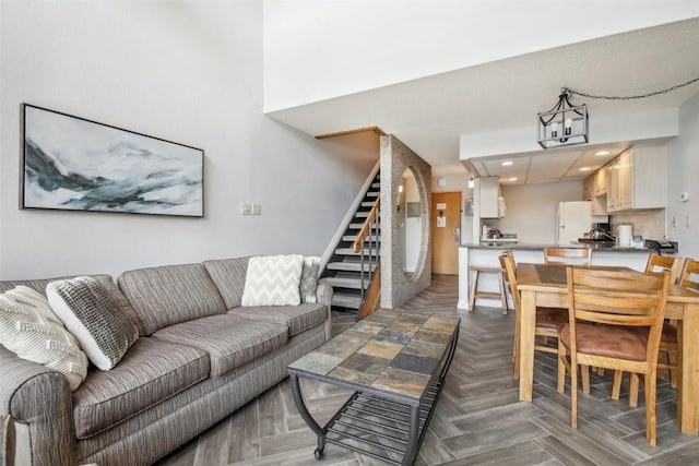 living room featuring dark parquet flooring