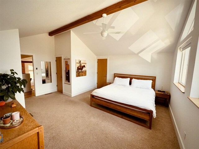 carpeted bedroom featuring lofted ceiling with beams and ceiling fan