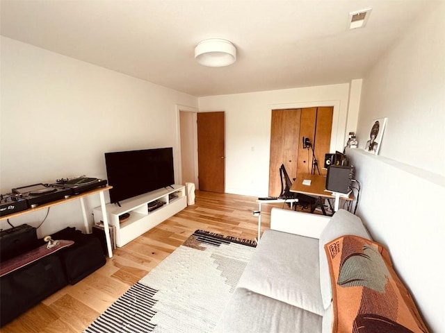 living room with light hardwood / wood-style floors