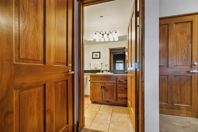 bathroom featuring toilet, vanity, and tile patterned floors