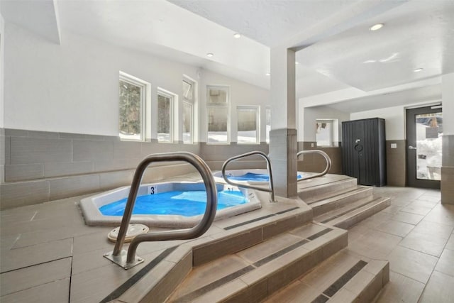 view of swimming pool featuring an indoor in ground hot tub