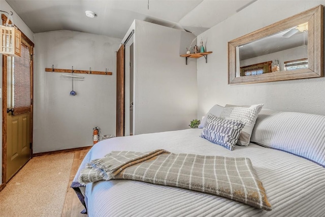 bedroom featuring lofted ceiling