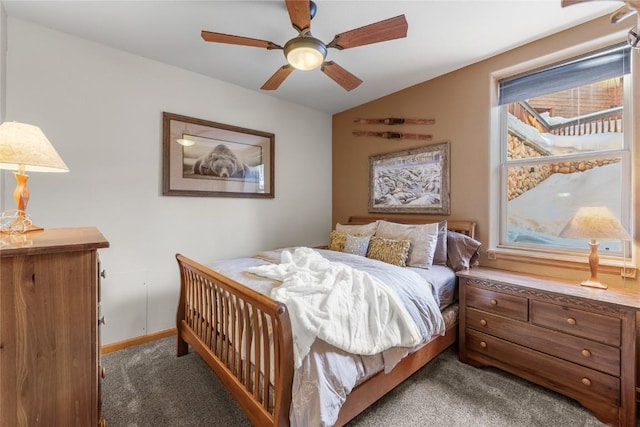 carpeted bedroom with baseboards, vaulted ceiling, and a ceiling fan