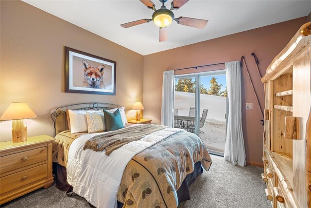 bedroom featuring ceiling fan, dark carpet, and access to exterior