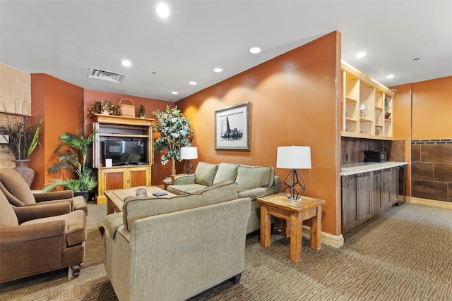 living room with carpet, visible vents, and recessed lighting