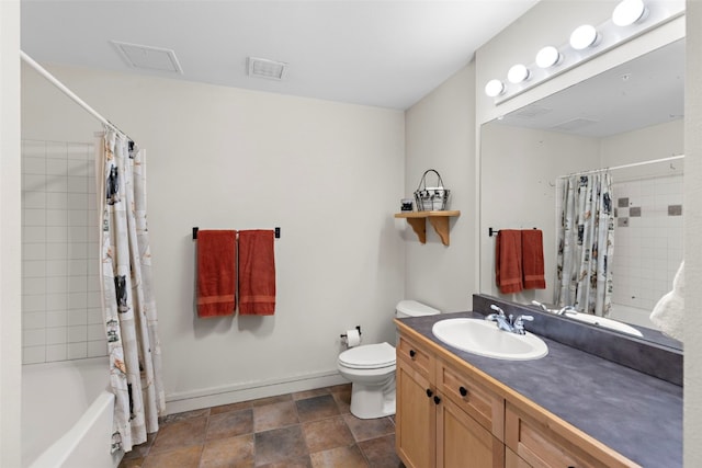 full bathroom with vanity, shower / bath combo, and toilet