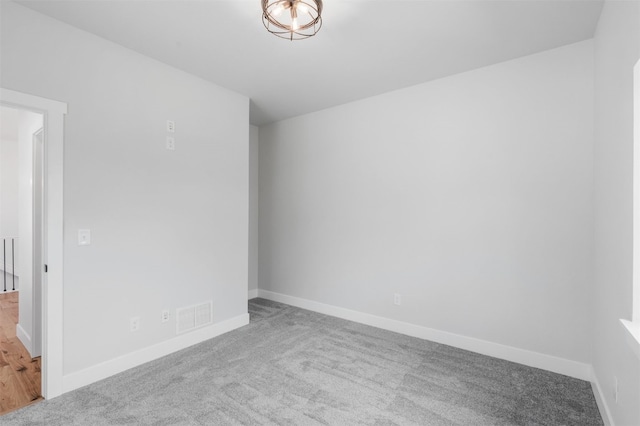 unfurnished room featuring carpet flooring