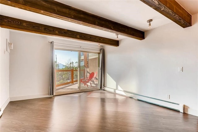 interior space featuring a baseboard heating unit and wood-type flooring