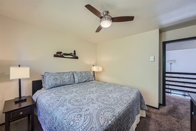 bedroom with ceiling fan and dark colored carpet