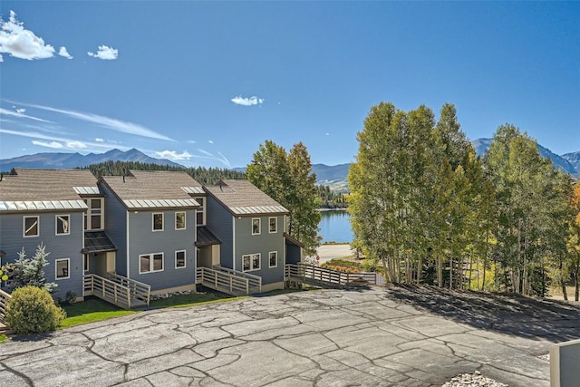 exterior space featuring a water and mountain view