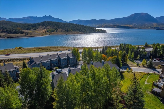 birds eye view of property featuring a water and mountain view