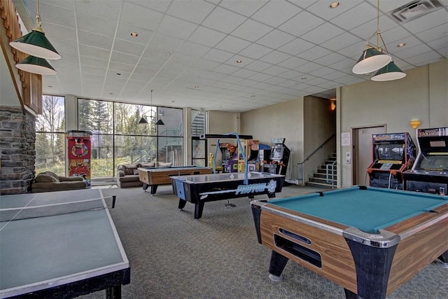 recreation room with floor to ceiling windows, a drop ceiling, carpet floors, and pool table