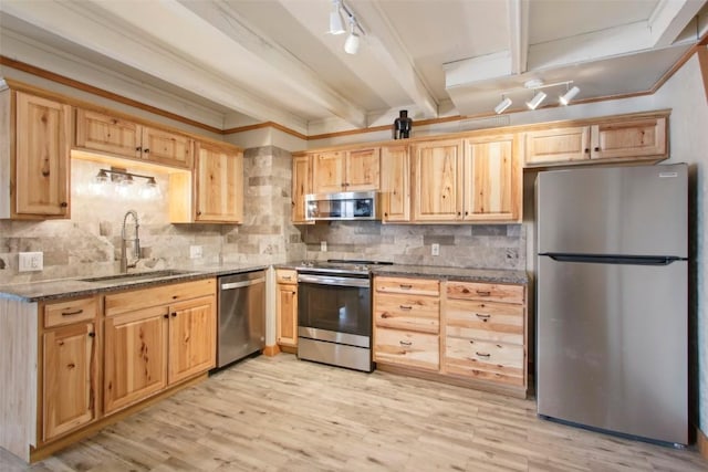 kitchen with sink, stainless steel appliances, light hardwood / wood-style flooring, beamed ceiling, and backsplash