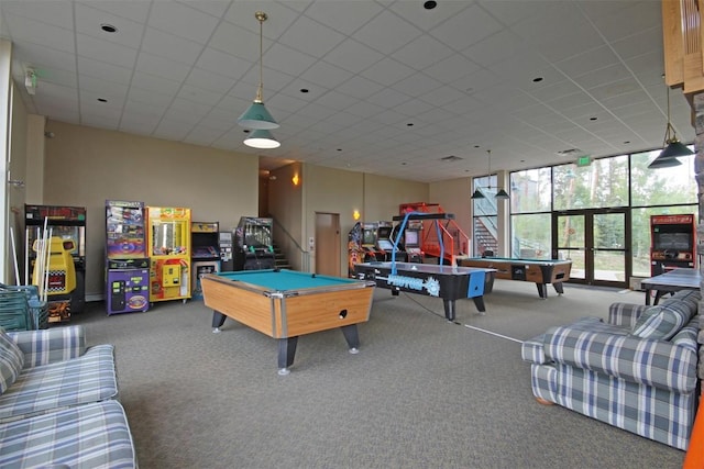 game room with carpet flooring, floor to ceiling windows, a drop ceiling, and billiards