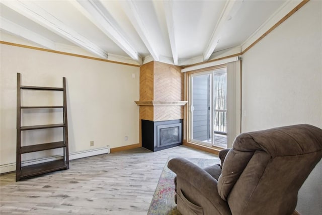 living room with a fireplace, beam ceiling, light hardwood / wood-style floors, and crown molding