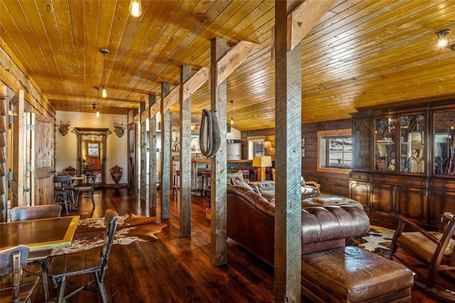 interior space with wood ceiling, dark wood-type flooring, and ornate columns