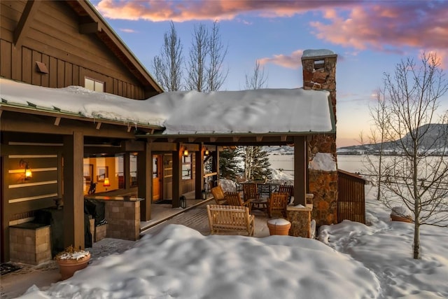 view of snow covered patio