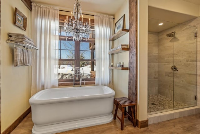 bathroom with hardwood / wood-style floors and plus walk in shower