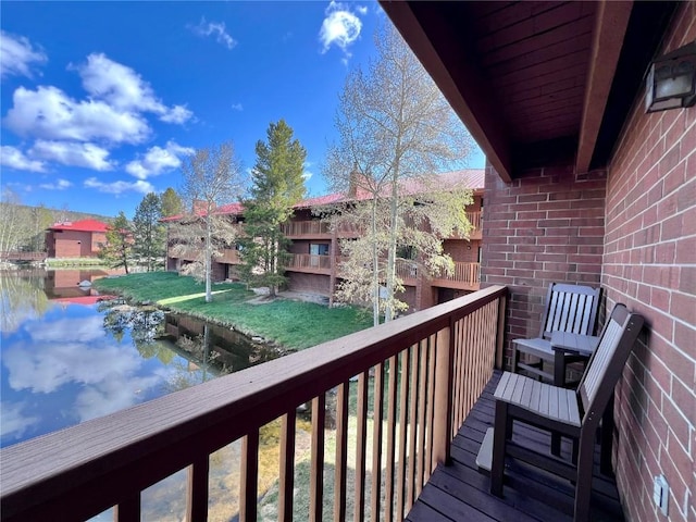 balcony featuring a water view