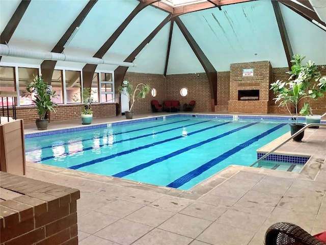 view of swimming pool with a fireplace