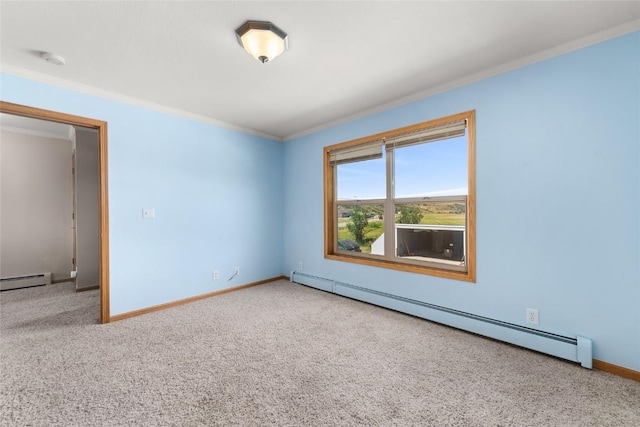 carpeted empty room with ornamental molding and a baseboard heating unit