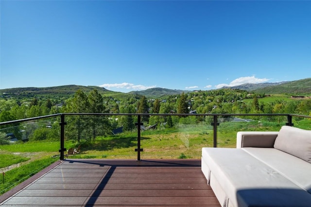 wooden deck with a mountain view