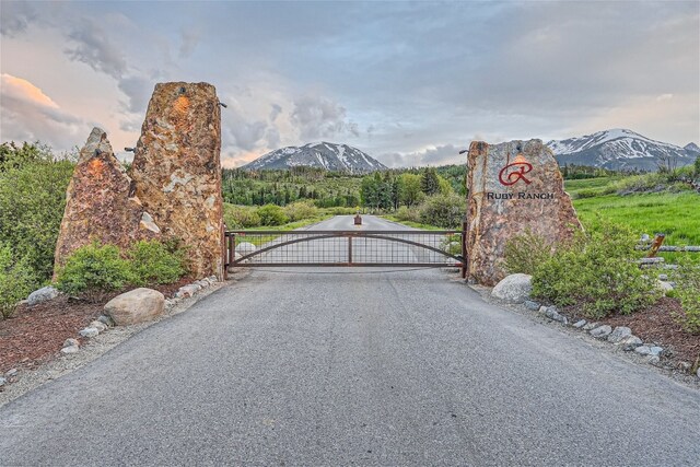 view of gate with a mountain view