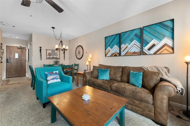 living room with light colored carpet and ceiling fan with notable chandelier