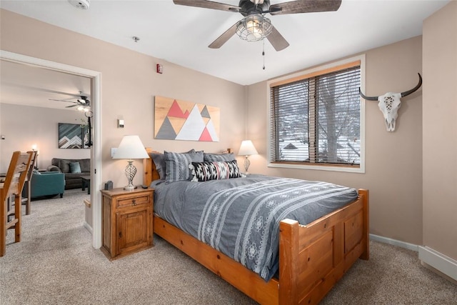 bedroom featuring ceiling fan and light carpet