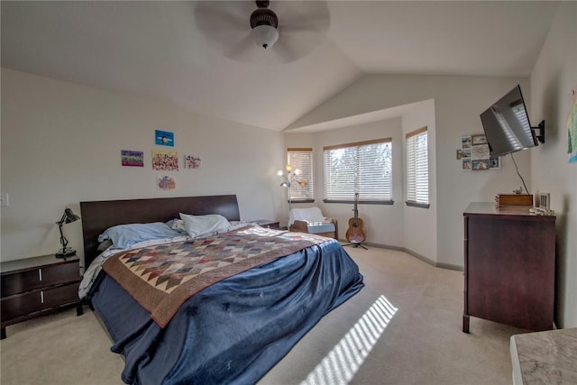 bedroom featuring lofted ceiling, light colored carpet, and ceiling fan