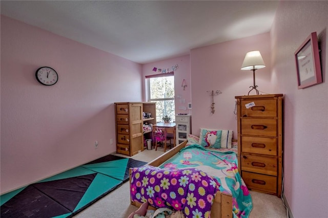 bedroom featuring light carpet