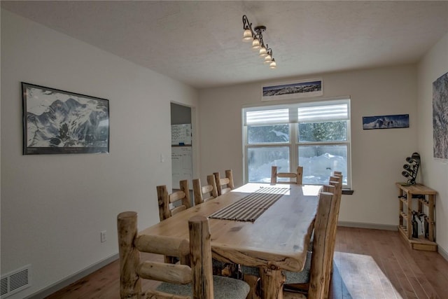 dining space featuring light hardwood / wood-style floors