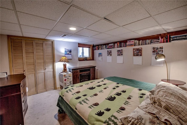 bedroom with a closet and light carpet