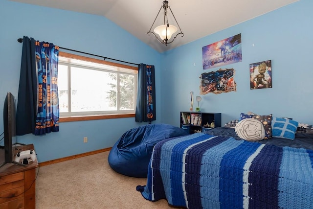 bedroom with carpet and lofted ceiling