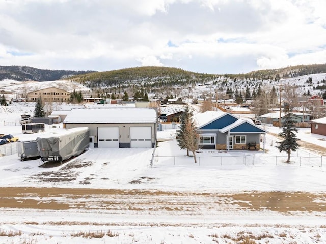 snowy aerial view with a mountain view