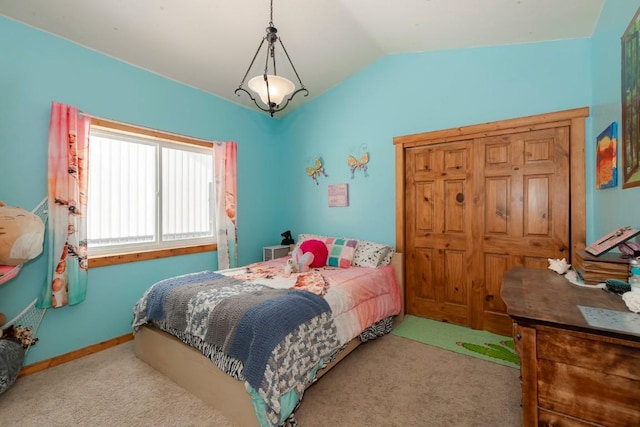 bedroom with light colored carpet and vaulted ceiling